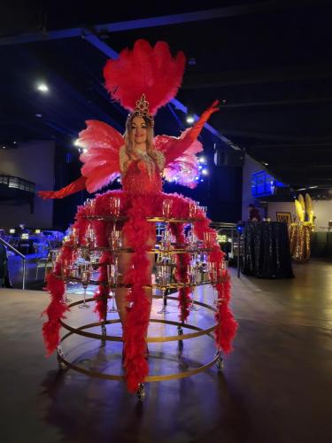 Red casino champagne skirt performer