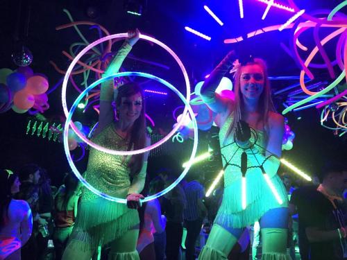 LED stiltwalkers on the dance floor in Boston